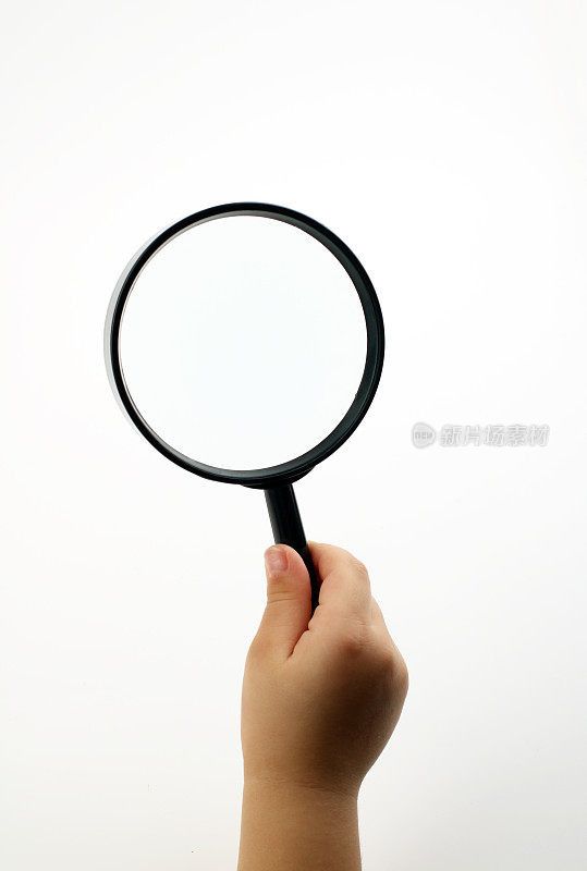 Child  holding magnifying glass